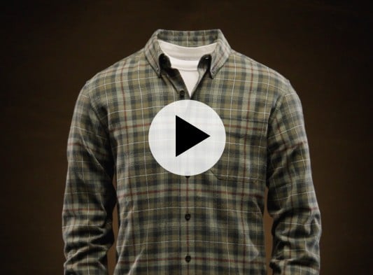 Plaid button-up shirt over white tee on headless mannequin, with play button icon centered on the image. 