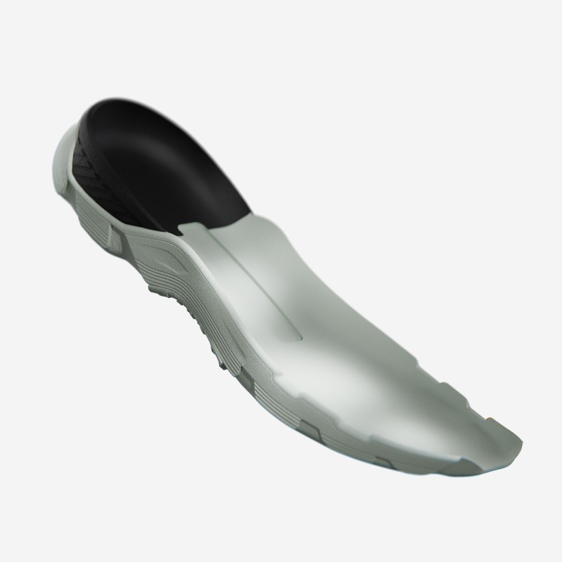 A gray and black shoe insole with a contoured arch and textured bottom.