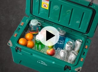 An image of a cooler full of ice and beverages with a video play icon in the middle.