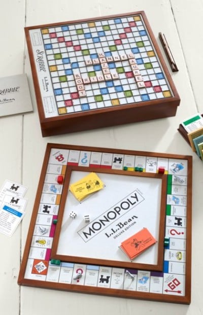 Board game pieces arranged on colorful game boards displayed on a tabletop.
