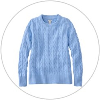 A blue crewneck sweater inside a light gray circle.