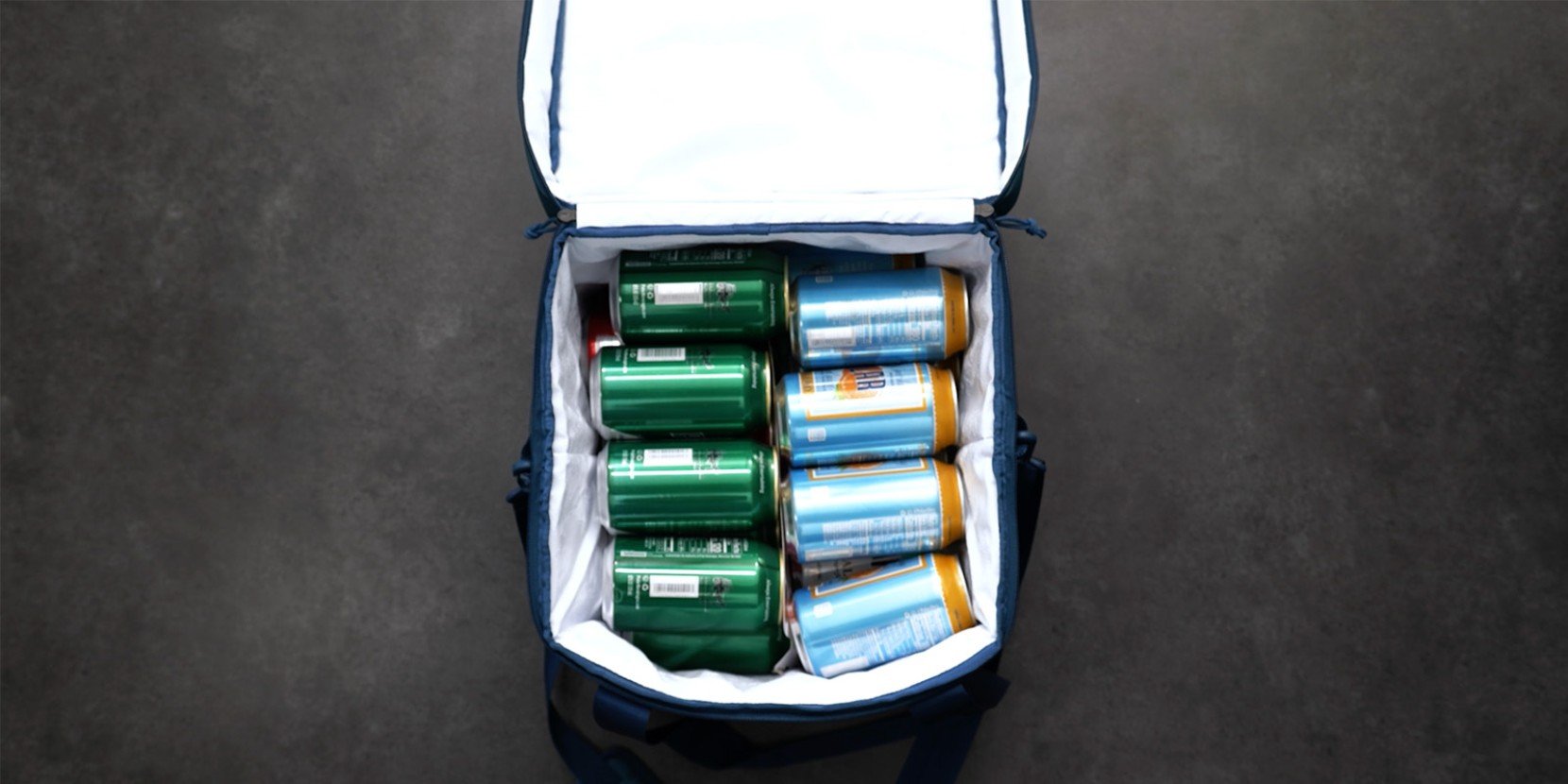 A L L Bean soft pack cooler neatly packed with cans of refreshing beverages.