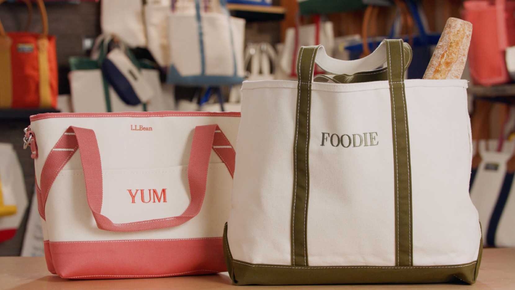 A large Boat & Tote with olive handles and monogram - FOODIE, and an insulated tote with reddish handles and monogram - YUM
