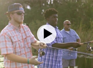 Three men fishing with spin rods.