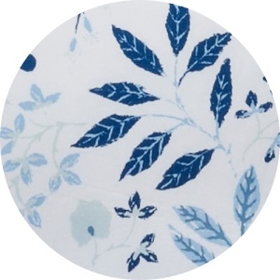 A circular swatch of a blue floral print bed sheet.