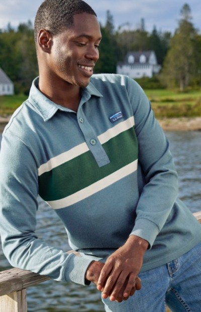 Waist up shot of a man in a long sleeved rugby polo.